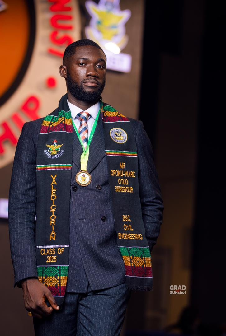 A graduate wearing the Ghana Kente sash, embroidered with his name and his degree.